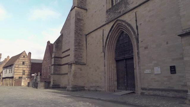 Walking to the Sint-Jan-De-Doperkerk gate at the Groot Begijnhof in Leuven, Belgium