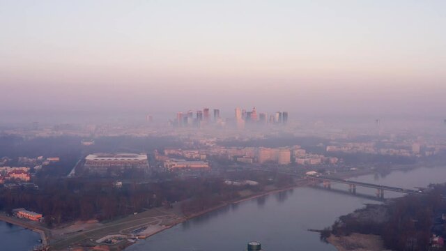 Skyscrapers in Warsaw above the fog during sunrise.