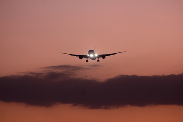 sunset approaching airplane