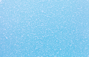 Cold natural background of ice floe surface with frozen crystals of ice and snow on frosty winter day. Blue backdrop of ice texture. Christmas and winter design, mock up, closeup, flat lay, copy space