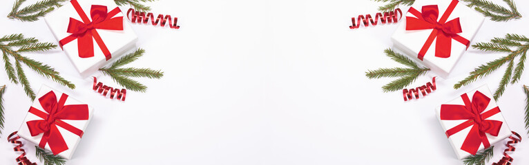 Xmas gifts and fir twigs on white