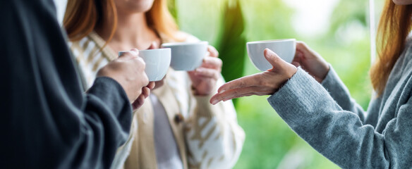 Closeup image of people enjoyed talking and drinking coffee together