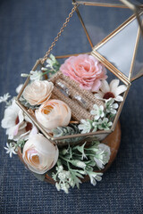 wedding ring on a cage with flowers