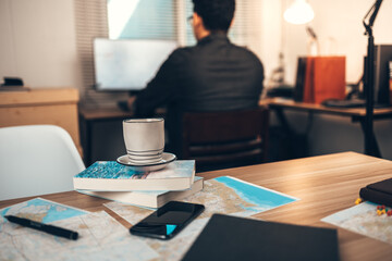 Map, Coffee, Toast, Camera, Book, and Pen on the table. Tourist planning vacation-holiday with  map.