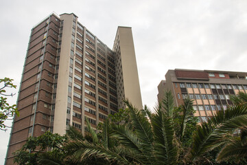 Fototapeta na wymiar Upward View of Tall Buildings Against Cloudy Sky in Durban, South Africa