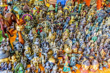 Traditional colorful god statues & souvenir shop at Dilli Haat, New Delhi. Dilli Haat is a craft market located run by Delhi Tourism and Transportation Corporation