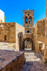 Fototapeta na wymiar Traditional architecture with the bell tower of Elcomenos Christos in the main square of the medieval castle of Monemvasia, Lakonia, Peloponnese, Greece