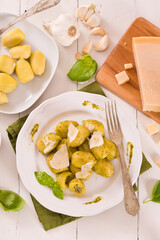 Potato gnocchi stuffed with pesto sauce.