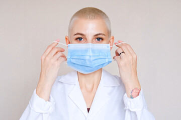 Doctor in a medical mask and protective suit against coronavirus infection.