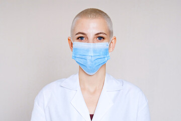 Doctor in a medical mask and protective suit against coronavirus infection.