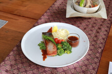 Grilled salmon with fresh vegetable salad