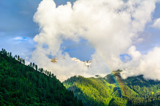 Clouds and Rainbow  over the Himalayan mountain in Himachal Pradesh, India
