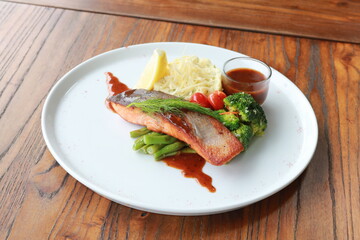 Grilled salmon with fresh vegetable salad