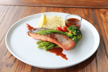 Grilled salmon with fresh vegetable salad