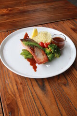 Grilled salmon with fresh vegetable salad