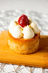 Mini raspberry, rosewater and pistachio cake, food background.