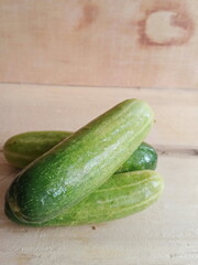 fresh cucumber during the day on a wooden background