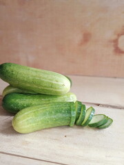 fresh cucumber during the day on a wooden background