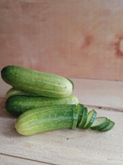 fresh cucumber during the day on a wooden background