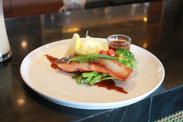 Grilled salmon with fresh vegetable salad