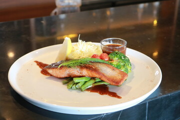Grilled salmon with fresh vegetable salad