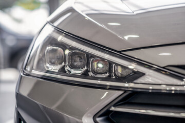 Fototapeta premium Close-up of new grey car front lights