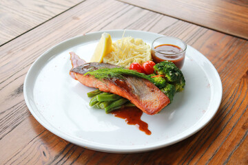 Grilled salmon with fresh vegetable salad