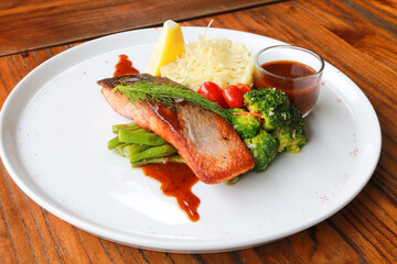 Grilled salmon with fresh vegetable salad
