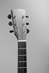 The fretboard of an acoustic guitar closeup. Studio photo of a musical instrument. Mockup