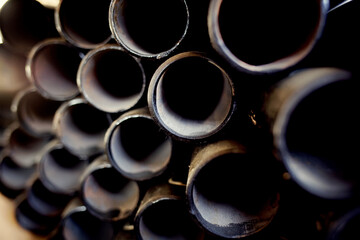 Black metal pipes and adapters of different diameters for gasification or water supply. Industrial...