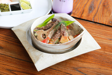 Beef Rib Soup or Sop Iga with Tomato, Carrots, and Potato.