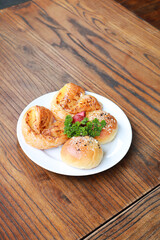 Fresh homemade bread on white plate.