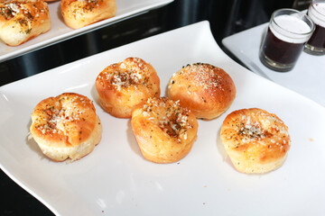 Fresh homemade bread on white plate.
