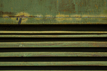 Metal sheet, garage detail, wall screwed in with bolts, nuts, screws, traces of green, emerald...