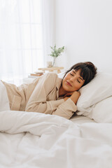 Woman sleeping on bed