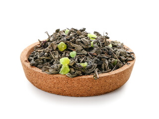 Plate with dry fruit tea on white background