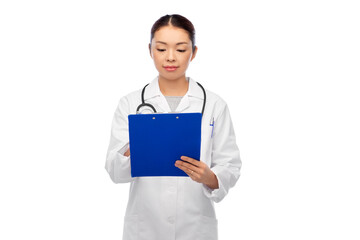 medicine, profession and healthcare concept - asian female doctor in white coat with clipboard and pen