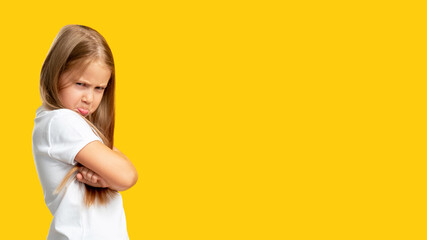 Naughty child. Disobedience problem. Discipline punishment. Portrait of angry offended little girl...