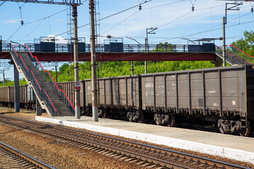 Freight, train at the station. Horizontally.