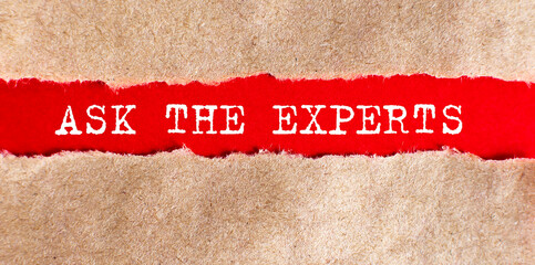 Ask the experts word written under torn paper, business