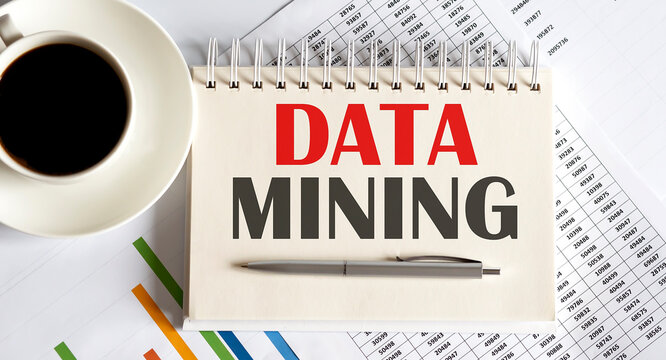 Data Mining Text Written On A Notebook With Pen And Chart