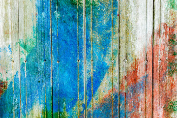 Wooden surface covered with splattered paint.