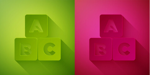 Paper cut ABC blocks icon isolated on green and pink background. Alphabet cubes with letters A,B,C. Paper art style. Vector.