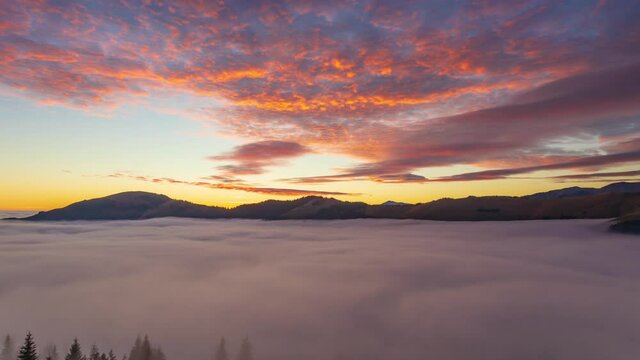 Beautiful time lapse video of sunset over sea of clouds