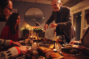 Family having Christmas dinner together