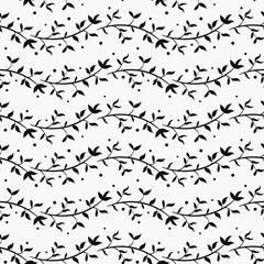 Abstract seamless pattern with black horizontal foliate twigs on white background; for greeting cards, invitations, posters, banners.