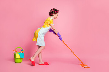 Full size profile side photo of pretty housewife wash mop floor wear yellow skirt latex gloves...
