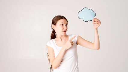 Young woman holding a speech bubble 