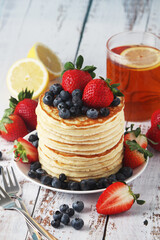 A stack if home-made pancakes with berry