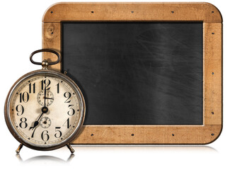 Old alarm clock, seven o'clock, and empty blackboard with wooden frame and copy space, isolated on...